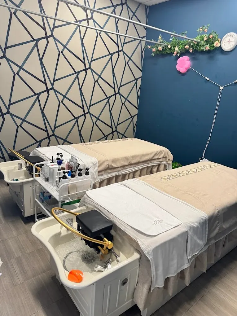 Two head spa stations side by side, each with a gold hydrotherapy basin, in the couples room at Pacific Massage & Head Spa in Redmond