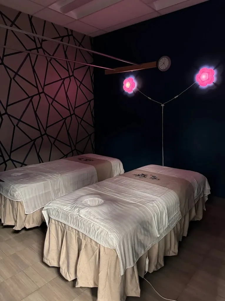 Two massage tables side by side in the couples room at Pacific Massage & Head Spa in Redmond